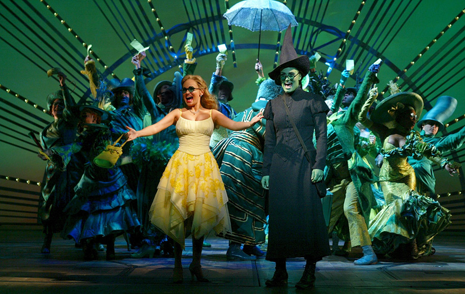 Kristin Chenoweth, Idina Menzel, and the original Broadway cast of <i>Wicked</i>.